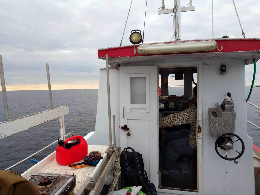 A view of the entrance to the steering house of Smolten and the sea in the background.