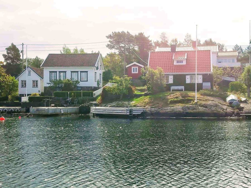 A couple of houses by the water.