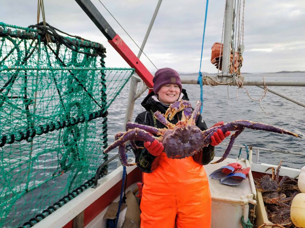 Me on deck during winter with a big Norwegian king crab in my hands.